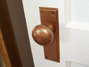 Copper door clearance knobs